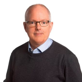 Portrait of Christer Martinelle from ProLifting–JJ Gruppen, smiling against a white background.