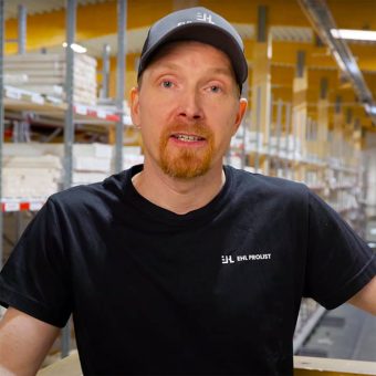 Portrait of John Glindevi from EHL Prolist / John Glindevi working with the railbound platform in warehouse.